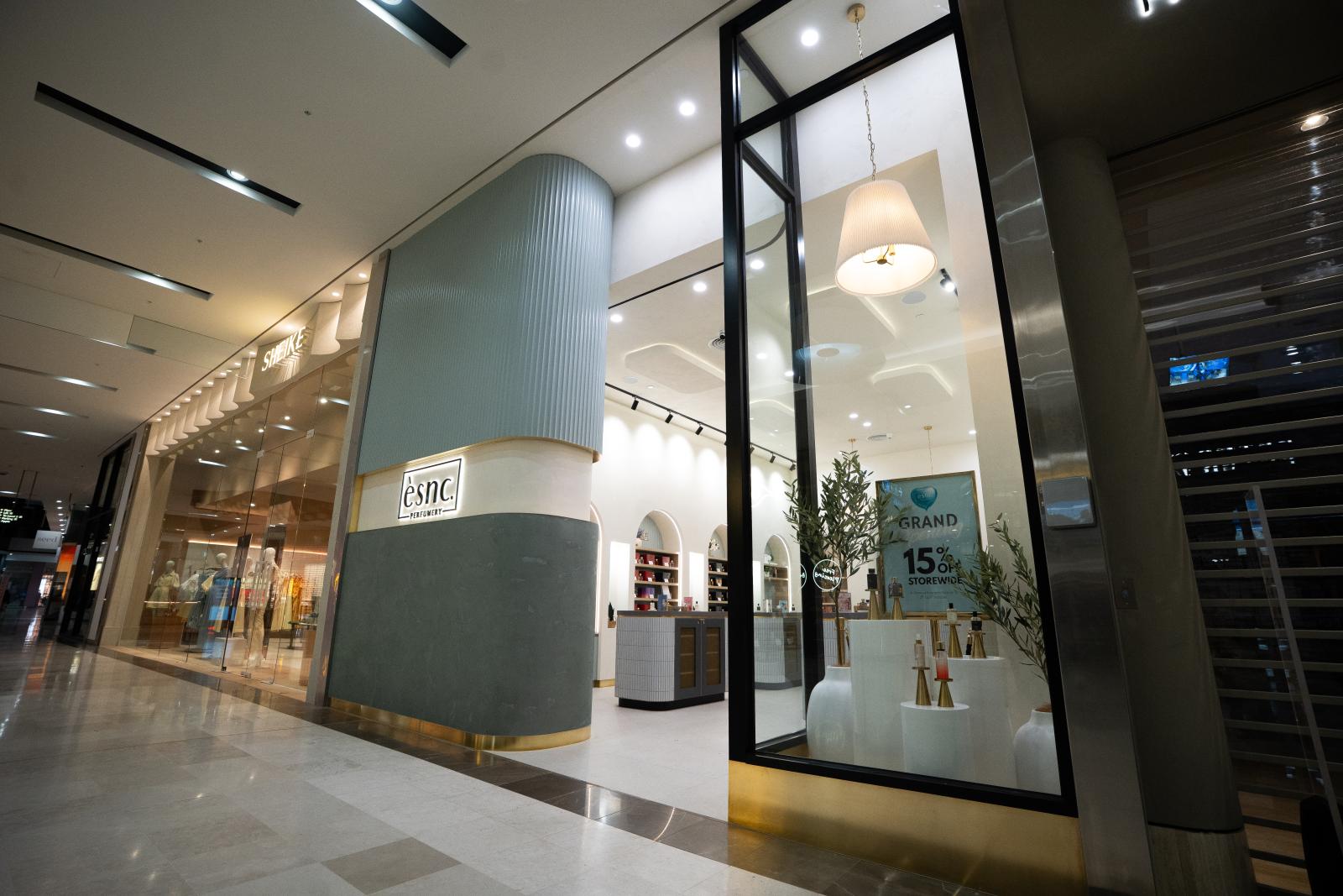 Modern retail shop fitout with black-framed glass doors and contemporary storefront design