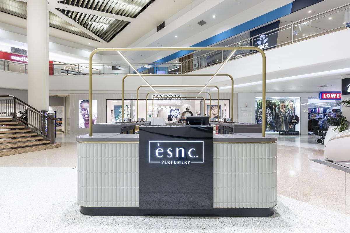 ESNC reception desk in modern shopping centre with minimalist design and contemporary finishes