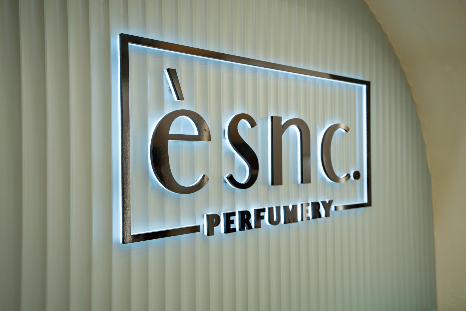 ESNC Perfumery illuminated shop signage mounted on corrugated metal wall
